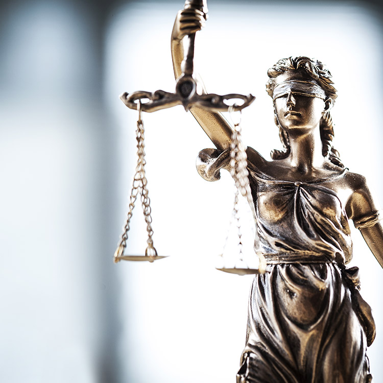 Image of Lady Justice holding scales
